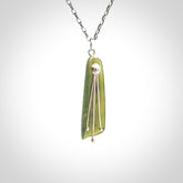 This kowhai flower drop pendant is beautifully hand made with gorgeous flair. It is fashionable and perfect for a women with style. Hand carved from a gorgeous piece of New Zealand jade with sterling silver - this is an elegant and beautiful piece of art to wear.